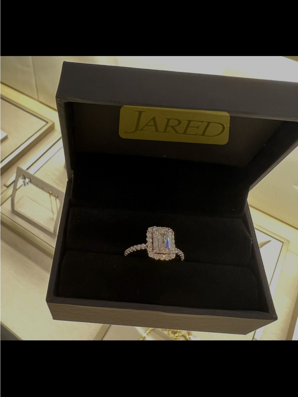 Emerald-Cut Halo Ring with White Center Stone